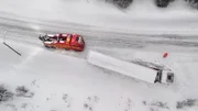 A truck got pushed off the road and ploughed into a snowbank where it's stuck, and the overhalla crew do not have the manpower to pull it out in Overhalla, Norway.