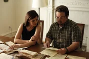 Rebecca and Mark reading letters.