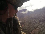 Papua New Guinea - Pete Kelsey on helicopter traveling to Etoa jungle.