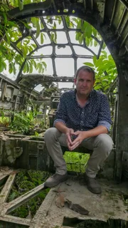 Papua New Guinea - Marty Morgan in the remains of B24 bomber.
