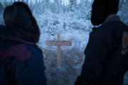 Daniel and Susan by their parents tombstone.