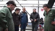 Michael Manousakis (r.) and his mechanics