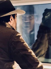 Ramy Romany looks at mummy under glass