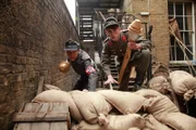 Dieter and a Luftwaffe Helper climb over the barricades holding Panzerfausts.