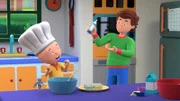 Papi hilft Caillou in der Küche.