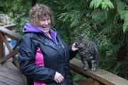 Mary Miller with her cat at her house in Port Protection.