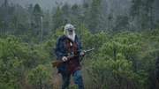 Gary Muhelberger searches for deer in forest near Port Protection. (National Geographic/Blair Madigan)