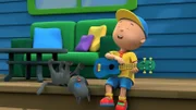 Caillou hat sich auf seiner Gitarre einen tollen Rocksong ausgedacht.