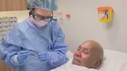 Emma and Krish post surgery showing Krish lump that has been removed