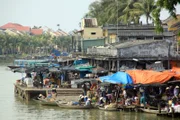 Boats on the river and traditional market in Hoian in Vietnam