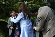 Arranged marriage couple, Hina Belitz and Kamran Ehsan, prepare their children, Haris Ehsan and Zakaria Ehsan for portraits.