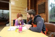 Matt Carlson colors with his daughter Shipley at the old Port Protection School.