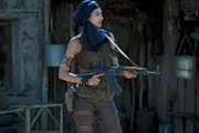 Woman with AK-47