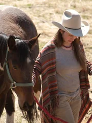 As a trust building exercise, Bird Brown learns to halter and lead her horse.
