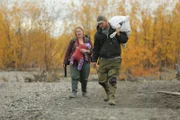 Selden family carrying fishing gear to their boat.