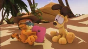 Garfield verliert sich in Urlaubsphantasien.