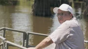 Geographer Richard Campanella takes a boat trip through a Lousiana swamp land.