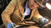 Ramy Romany works on artifact