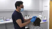 The doctor examines the patient