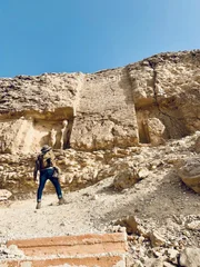 Ramy Romany walks toward ruins.