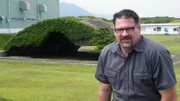 KANOYA, JAPAN - Mike Pavelec sits in front of the shelter the Japanese used to store the Mitsubushi Zero.