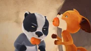 Matteo und Rosie versuchen einen Apfel zu essen, ohne dabei die Hände zu benutzen.