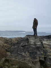 Waves crash on rocks below Forrest Galante.