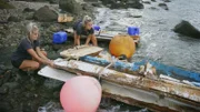The cleanup team dispose of the remains of a houseboat
