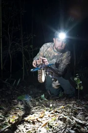 Forrest Galante demonstrates the careful handling of Deinagkistrodon Acutus.