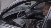 Demery (John Nicholson) is in his vehicle.
