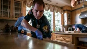 Police officers searching through home of Sherra Wright.