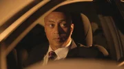 Demery looks out of his car.