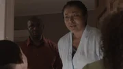 A woman and a man looks stunned at children in the doorway.