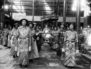 Imperial Dowager Empress of China, being carried by palace eunuchs