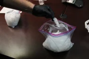 Officer David Schweizer holds pure crystal methamphetamine called "shard."