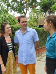 Portrait shot of agent Ha Phan (right) with contributors Pierre Fabra and Paige Brennan in Hoi An, Vietnam as seen on their house tour for House Hunters International. (exterior)
