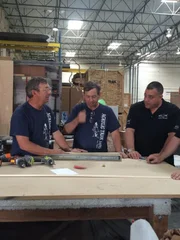 Rick and Vic talking to Brett in the shop during the build process.