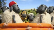 Centre Bitzer, the sheepdog, and lamb Shaun