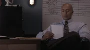 Demery looks at a page at his desk.