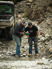 L-R: Rick and Brennan inspecting a pan.
