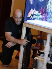 Brett Raymer with an Shaquille O'Neal for the reveal of his fish tank.