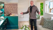 Mike showing off some of the new features of the new basement living room.