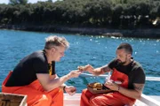 Croatian Chef, David Skoko (R), servers Gordon Ramsay conger eel pâté.