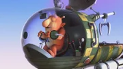 Groobie macht einen Testflug: Um keine schweren Sachen mehr schleppen zu müssen, hat er einen Spezialmagneten mit einem Seil an seinem Raumschiff befestigt.