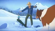 Erschrocken sehen Zoé (hinten) und Lassie, wie das Eis des Gletschers nachgibt und Graham in eine Spalte fällt.