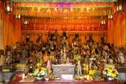 PHUKET, THAILAND - A shrine with a variety of deities statues stacked up around it inside the Bang Neow Shrine.