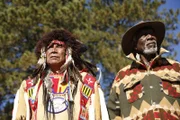 DEVILS TOWER, WYO - Morgan Freeman and the Chief of the Lakota, Dakota, and Nakota Nations and 19th Generation Keeper of the Sacred White Buffalo Calf Pipe Bundle, Chief Arvol Looking Horse, standing side by side as the take in the great view before them.
