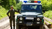 Polish Border Guard, Michal Golabek next to his vehicle.