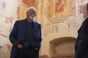 Morgan Freeman and Roberto Rusconi laugh on set at the San Bevignate church.