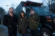 Nick Groff, Elizabeth Saint, and Bill Hartley pose outside of the team van.
